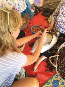 Melanee cracking argan nuts in Morocco