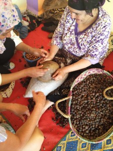 Women in Morocco cracking argan nuts