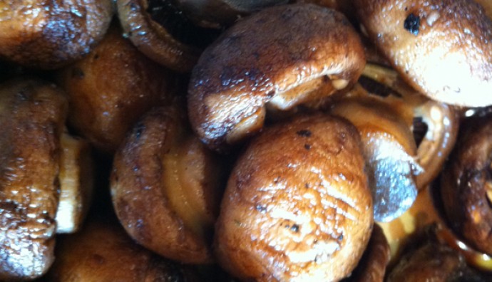 A close up picture of a few grilled mushrooms