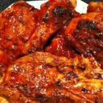 Grilled chicken covered in red sauce