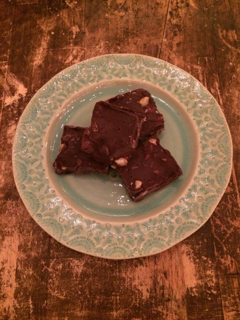 Four pieces of fudge on a light blue plate