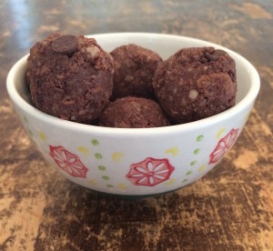 Cashew brownie balls in a small white bowl