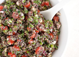 Red Quinoa Tabouli Salad in a white bowl
