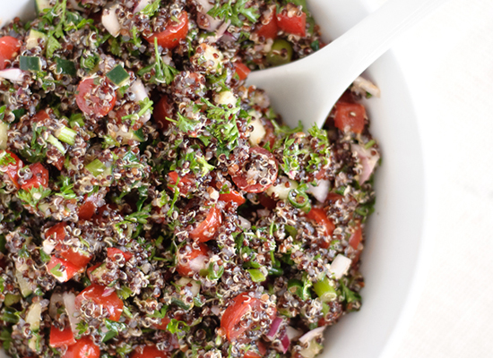 Red Quinoa Tabouli Salad in a white bowl