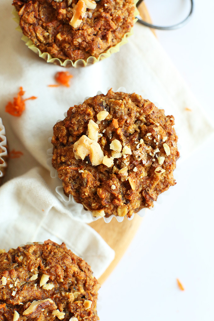 A few carrot muffins on a white kitchen towel