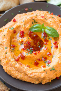 Hummus sprinkled with finely chopped sun dried tomatoes
