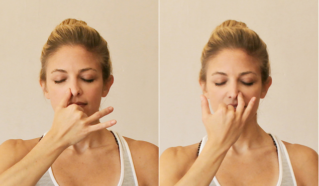 A woman doing the alternate nostril breathing practice