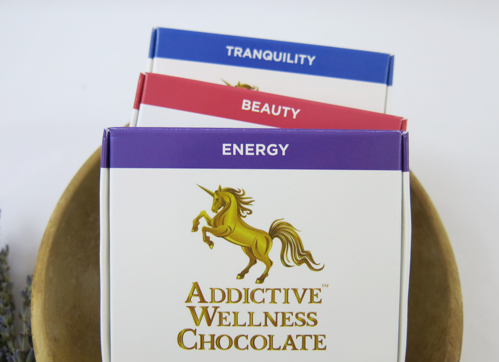 Three boxes of Addictive Wellness Chocolate